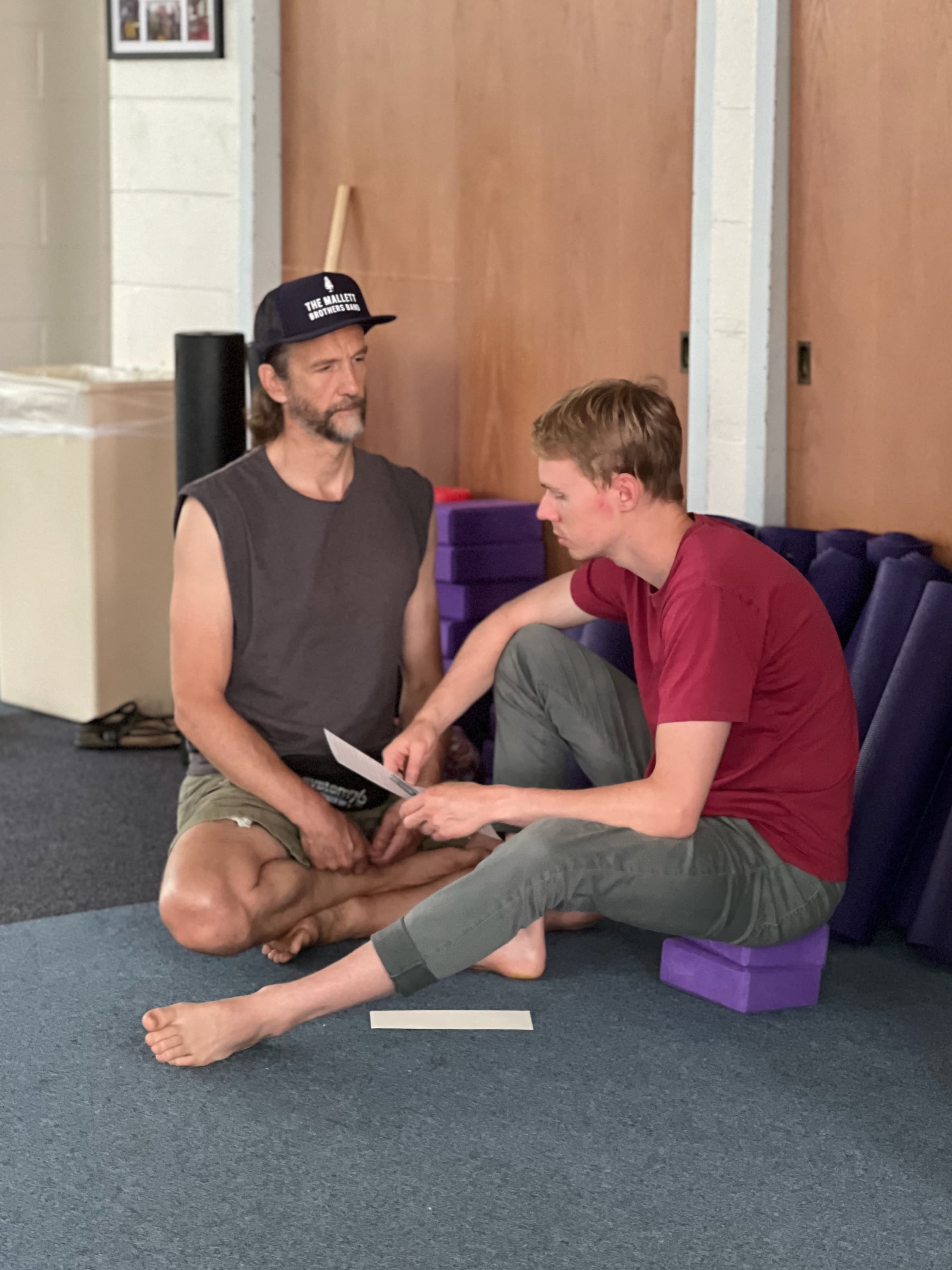 Two campers working through a paired exercise