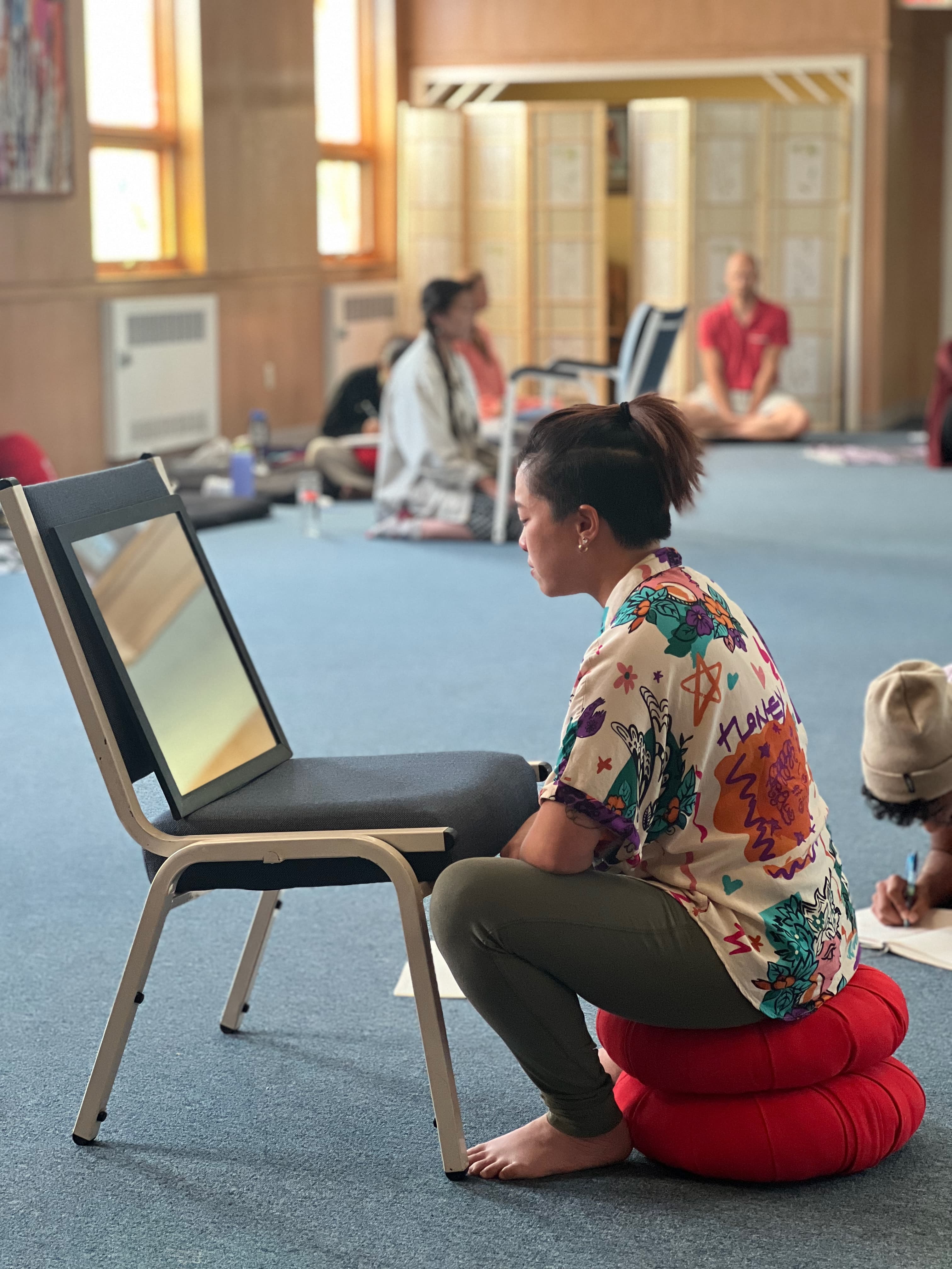A camper doing empty-chair work during a session