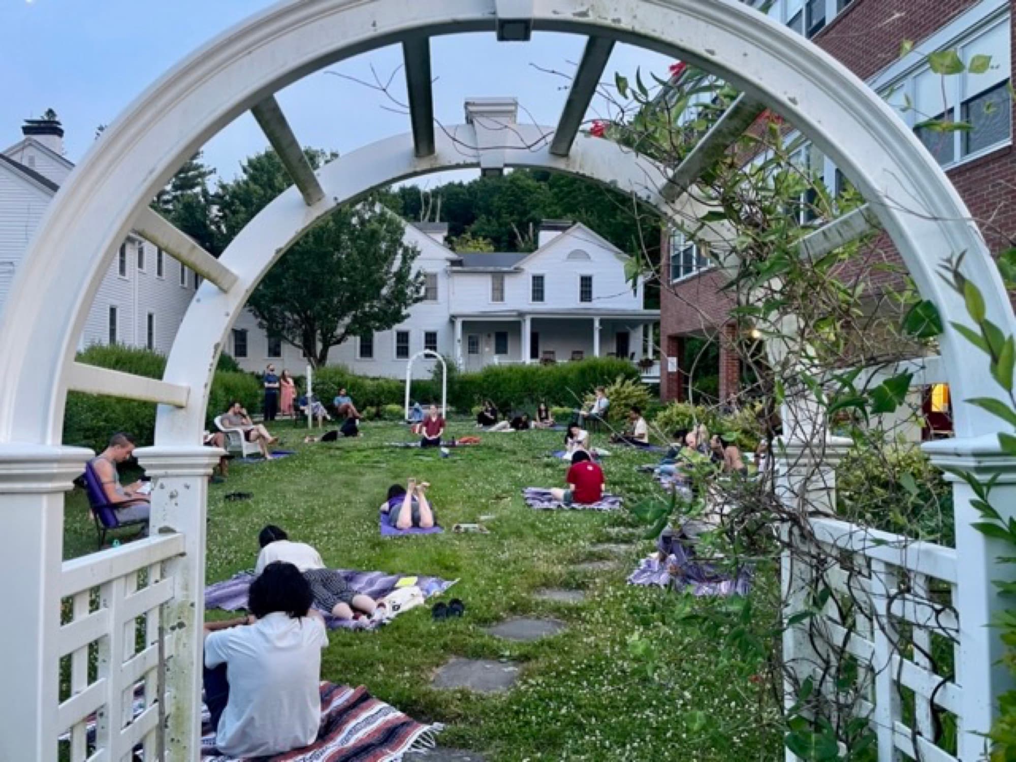 Campers gathered together on the lawn outdoors