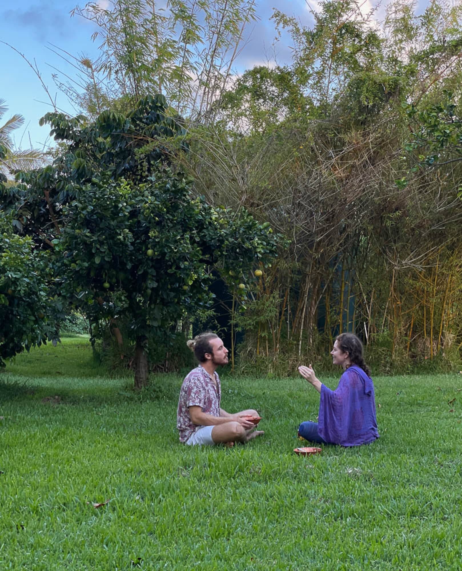 Two people in close, attentive conversation outdoors