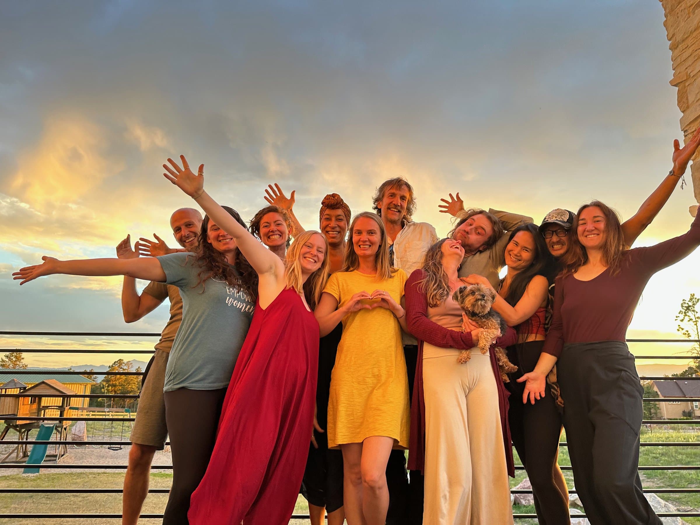 The Sleepawake team together at sunset, arms raised